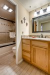 Full bathroom with closing door allows more than one person to get ready on busy mornings